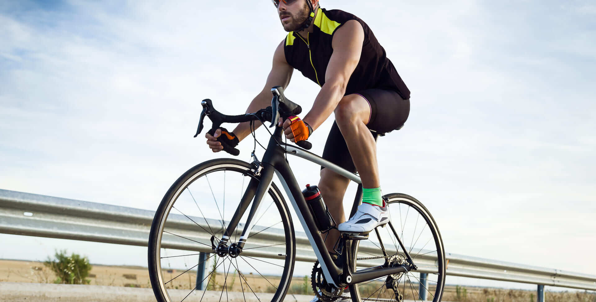 handsome young man cycling on the road 2022 12 15 18 18 17 utc
